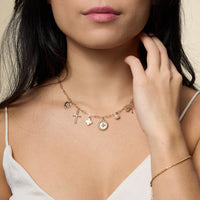 Charm Necklace with Heart, Cross, Compass Pearl, and Bow Pendants