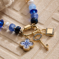 Colorful Beaded Charm Bracelet with Gold Trio Accents