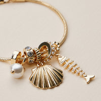 Gold Dipped Multi Charm Bracelet – Symbolic Pendant Collection