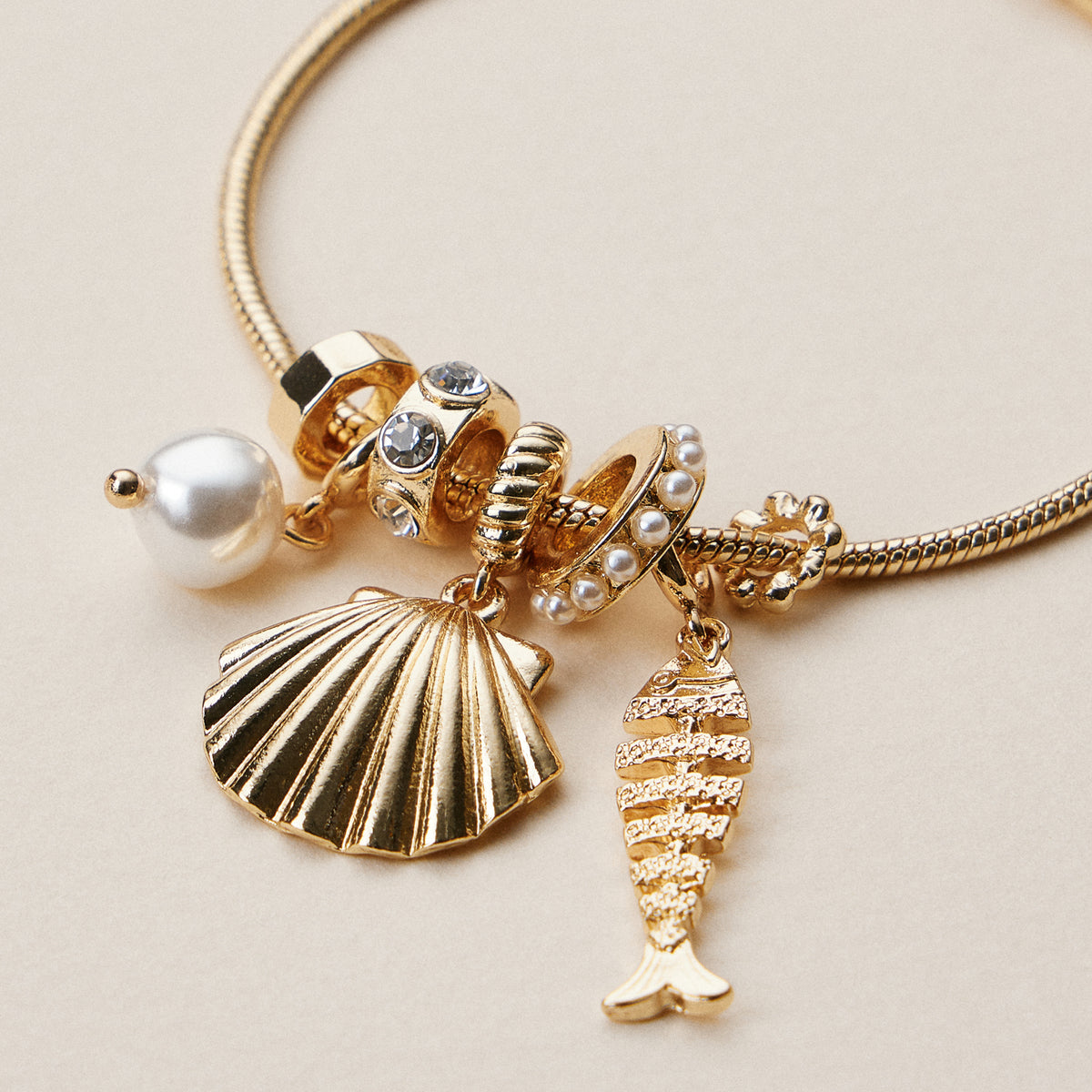 Gold Dipped Multi Charm Bracelet – Symbolic Pendant Collection