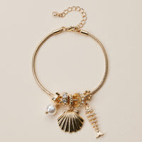Gold Dipped Multi Charm Bracelet – Symbolic Pendant Collection