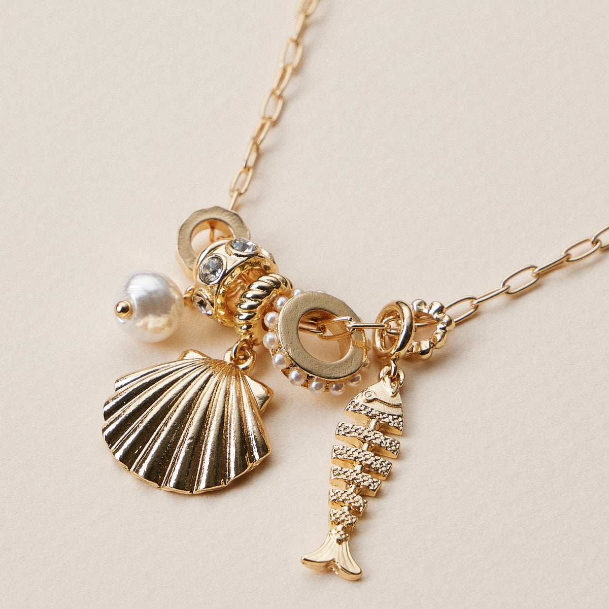 Gold Dipped Symbolic Multi Charm Necklace Collection