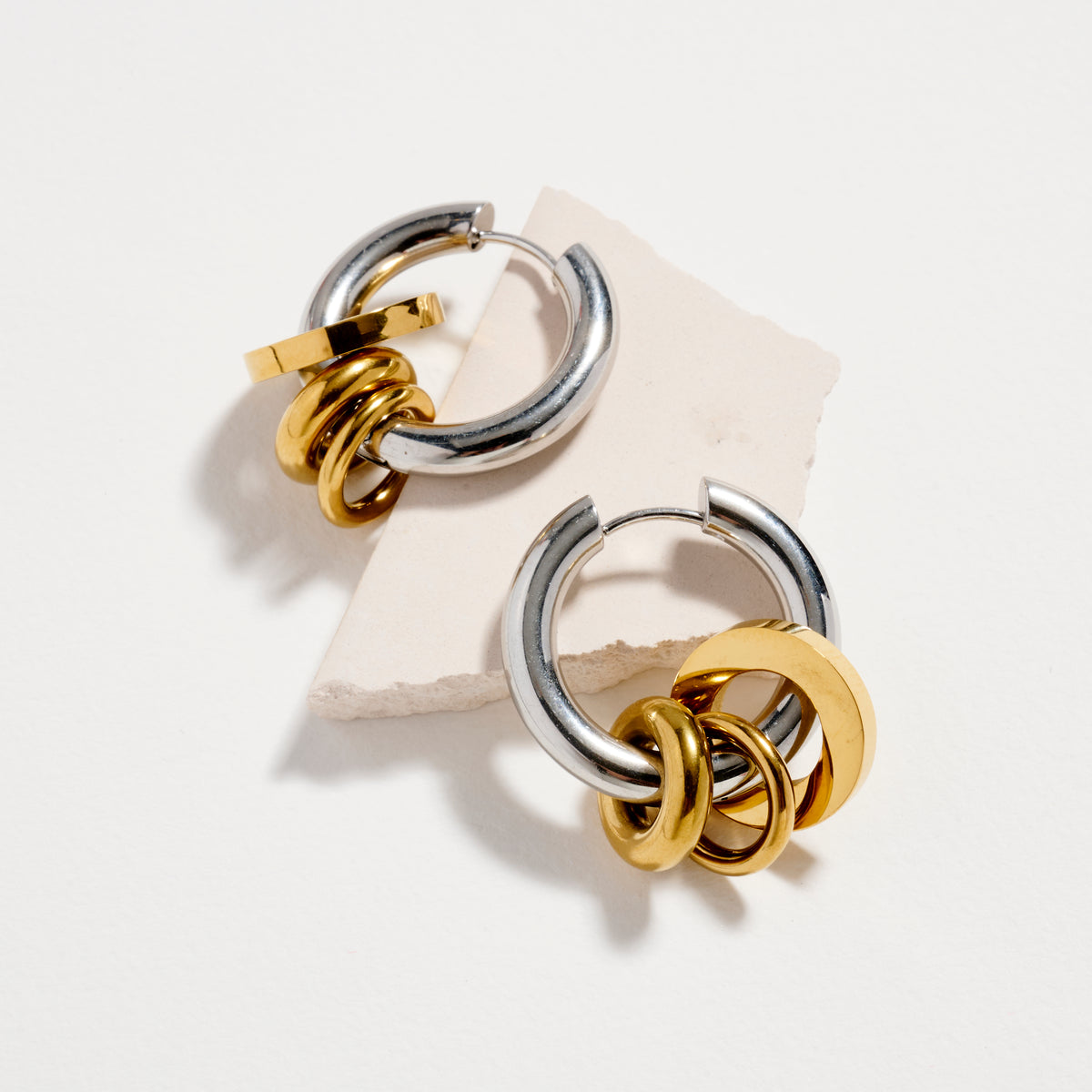 Stainless Steel Interlocking Hoop Earrings – Two Tone / Gold