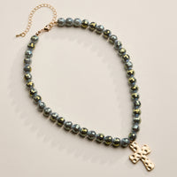 Faceted Beaded Necklace with Hammered Cross Pendant