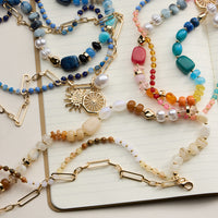 Layered Beaded and Chain Necklace with Sun and Pearl Charms – Gold Accent Design