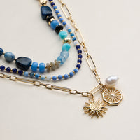 Layered Beaded and Chain Necklace with Sun and Pearl Charms – Gold Accent Design