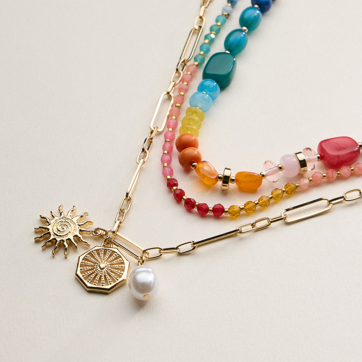 Layered Beaded and Chain Necklace with Sun and Pearl Charms – Gold Accent Design