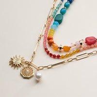 Layered Beaded and Chain Necklace with Sun and Pearl Charms – Gold Accent Design