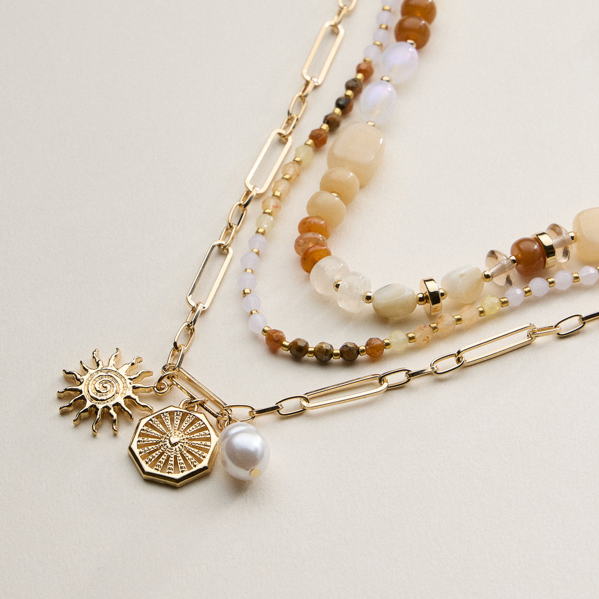 Layered Beaded and Chain Necklace with Sun and Pearl Charms – Gold Accent Design