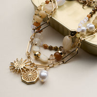 Layered Beaded and Chain Necklace with Sun and Pearl Charms – Gold Accent Design