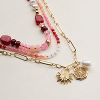 Layered Beaded and Chain Necklace with Sun and Pearl Charms – Gold Accent Design