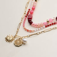 Layered Beaded and Chain Necklace with Sun and Pearl Charms – Gold Accent Design