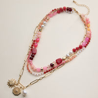 Layered Beaded and Chain Necklace with Sun and Pearl Charms – Gold Accent Design