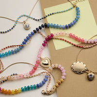 Layered Beaded and Pendant Necklace Set with Gold Accents – Heart and Charm Detail