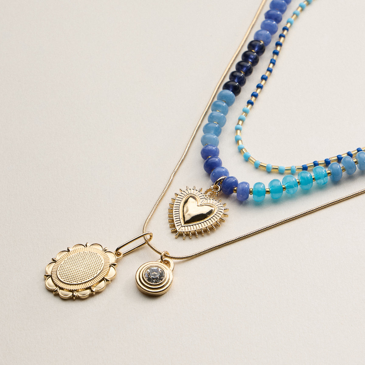 Layered Beaded and Pendant Necklace Set with Gold Accents – Heart and Charm Detail