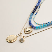 Layered Beaded and Pendant Necklace Set with Gold Accents – Heart and Charm Detail