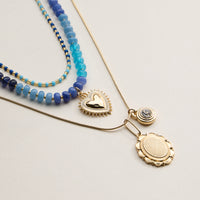Layered Beaded and Pendant Necklace Set with Gold Accents – Heart and Charm Detail