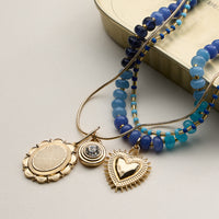 Layered Beaded and Pendant Necklace Set with Gold Accents – Heart and Charm Detail