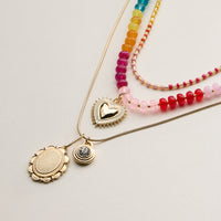 Layered Beaded and Pendant Necklace Set with Gold Accents – Heart and Charm Detail