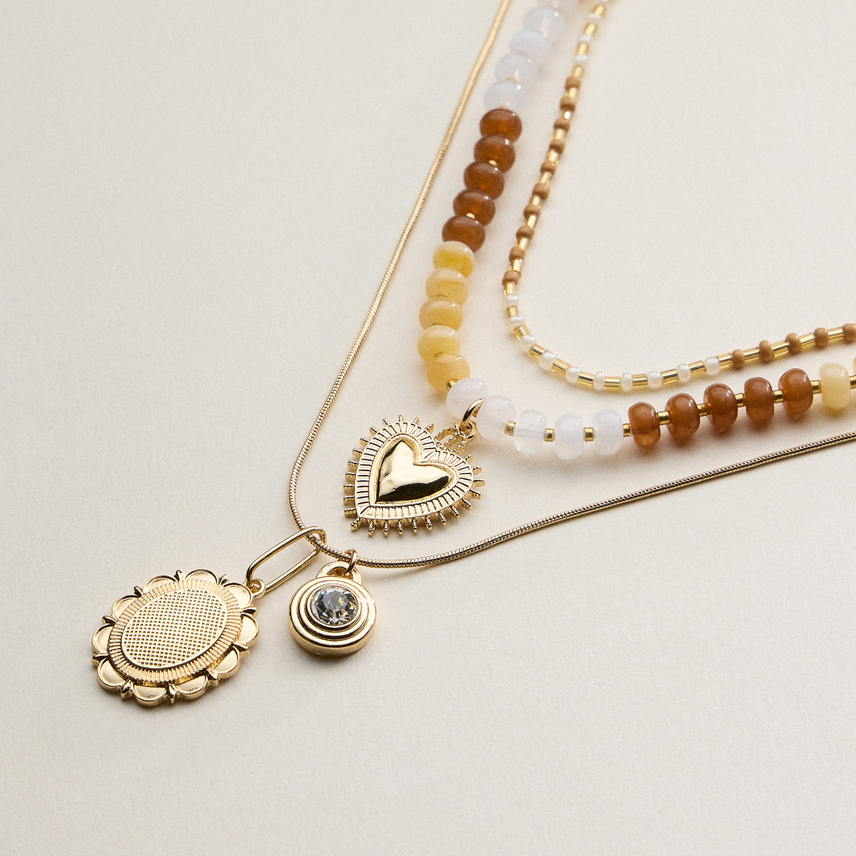 Layered Beaded and Pendant Necklace Set with Gold Accents – Heart and Charm Detail
