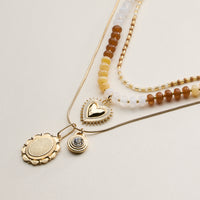 Layered Beaded and Pendant Necklace Set with Gold Accents – Heart and Charm Detail