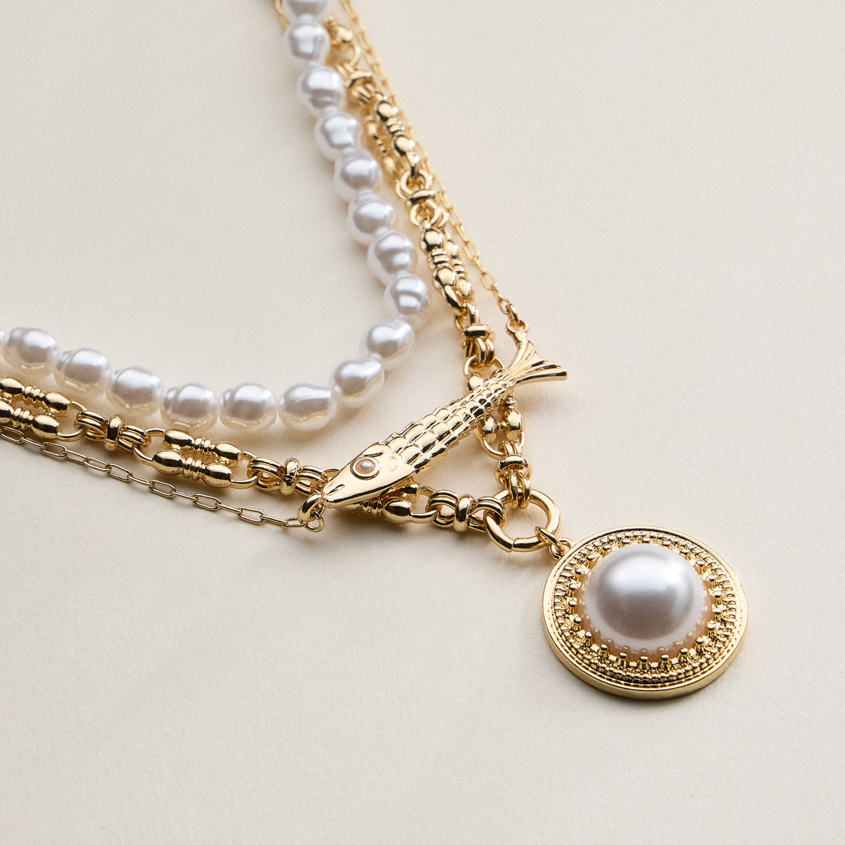 Layered Pearl and Chain Necklace with Round Pendant – Fish Link Detail