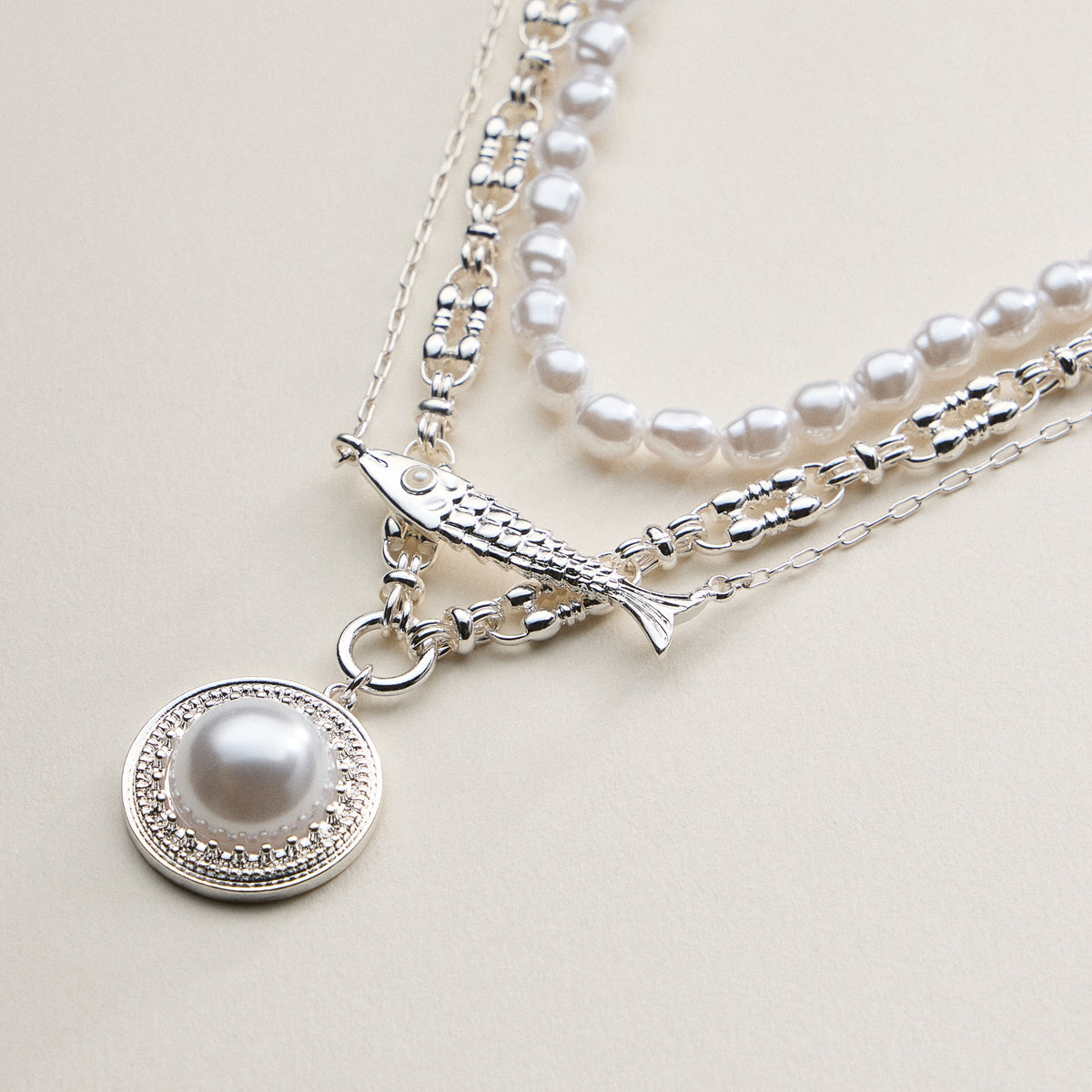 Layered Pearl and Chain Necklace with Round Pendant – Fish Link Detail
