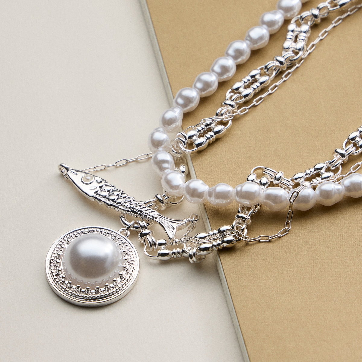 Layered Pearl and Chain Necklace with Round Pendant – Fish Link Detail