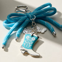 Western Boot Shaped Enamel Keychain with Blue Bow