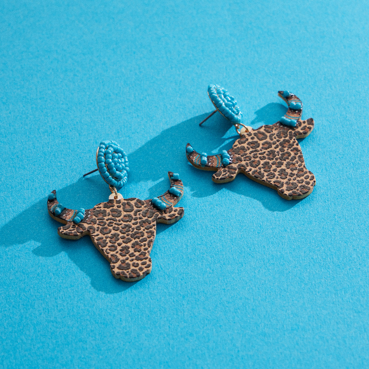 WOODEN COW HORNED HEAD EARRINGS