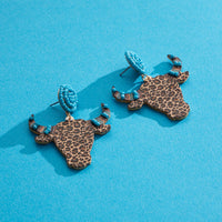 WOODEN COW HORNED HEAD EARRINGS