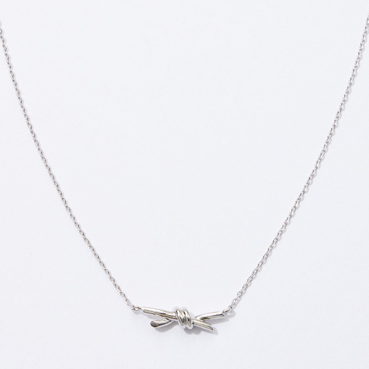 gold dipped knot pendant necklace