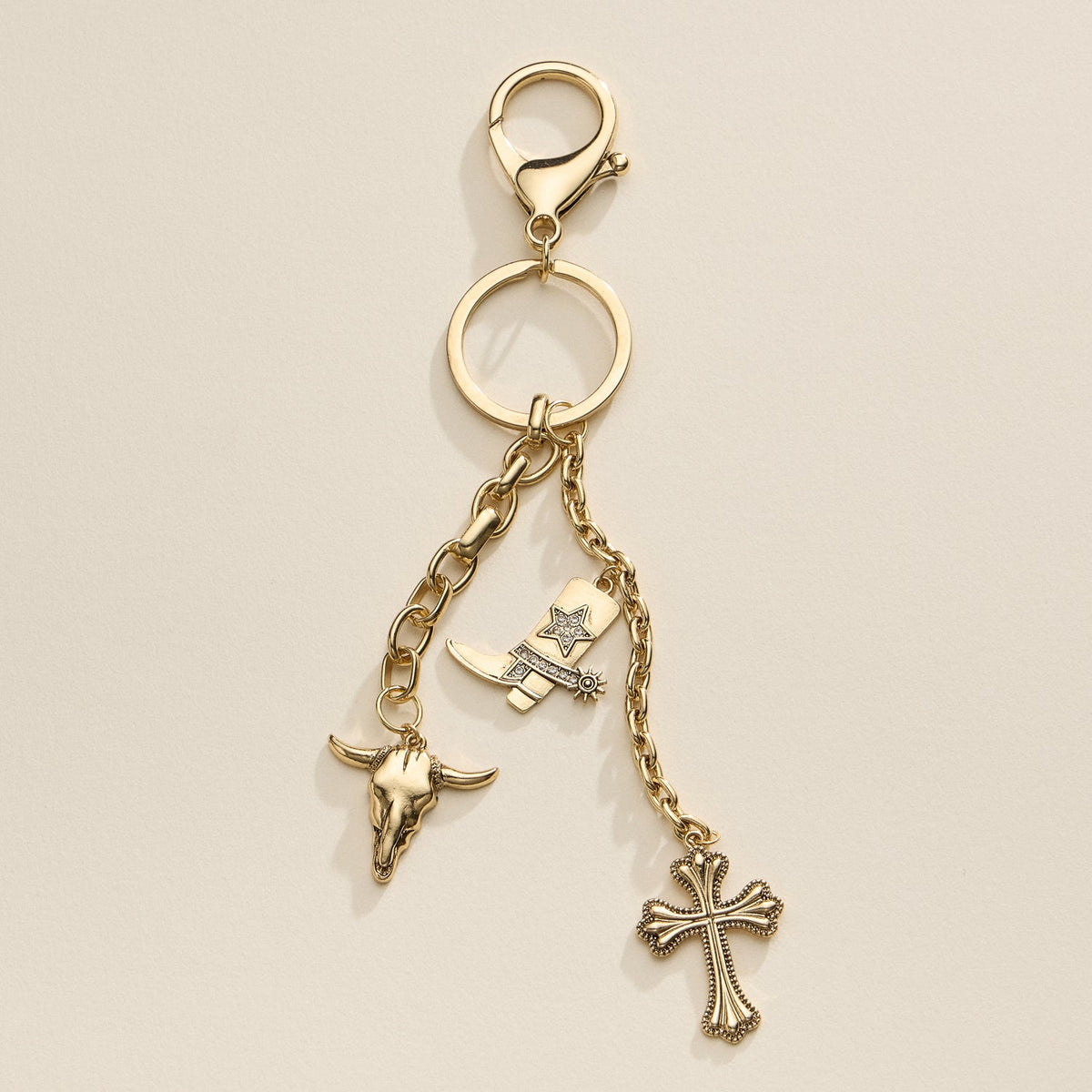 Western Charm Keychain with Cowboy Boot, Skull, and Cross Accents